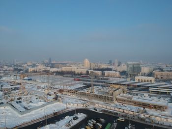 High angle view of buildings in city against clear sky