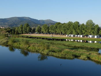 Scenic view of calm lake against sky