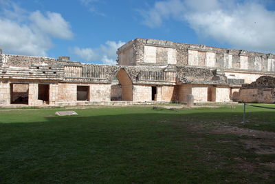 View of old building against cloudy sky