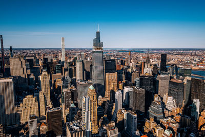 Aerial view of city buildings against sky