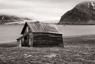 Abandoned shack at svalbard coast