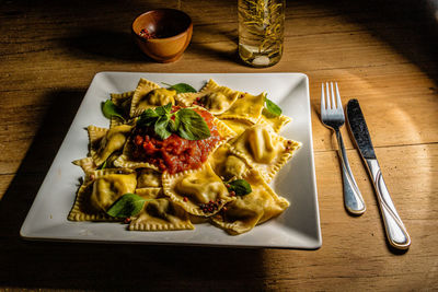 High angle view of italian pasta served on table