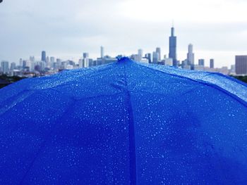 View of cityscape against blue sky