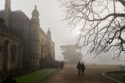 Rear view of man walking on street