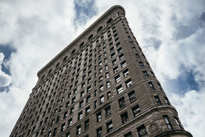 Low angle view of historical building against cloudy sky