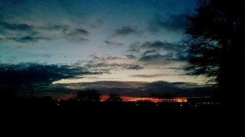 Scenic view of landscape against sky at dusk