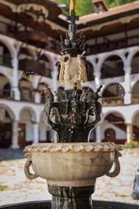 Close-up of fountain against building