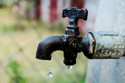 Close-up of water drops on faucet