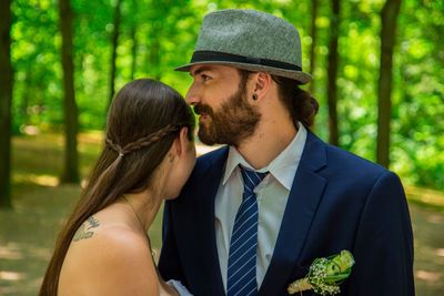 Young couple standing in forest