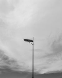 Low angle view of street light against sky