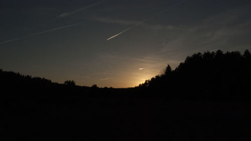 Scenic view of silhouette landscape against sky at sunset