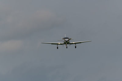 Low angle view of airplane flying in sky