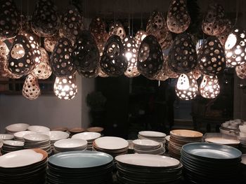 Illuminated decoration hanging over plates and bowls