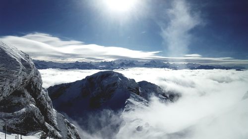 Low angle view of snowcapped mountains against sky