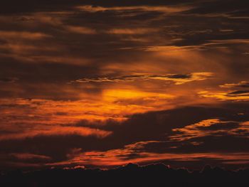 Low angle view of dramatic sky during sunset