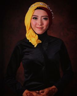 Portrait of smiling young woman wearing traditional clothing