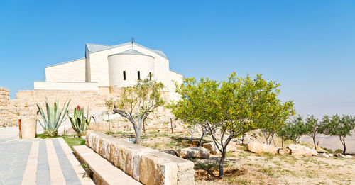 View of historical building against clear blue sky