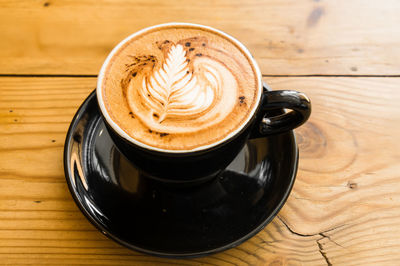 High angle view of cappuccino on table