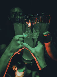 Close-up of hand holding wine glass