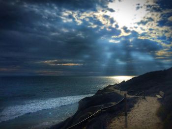 Scenic view of sea against cloudy sky