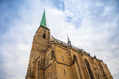 Low angle view of clock tower against sky