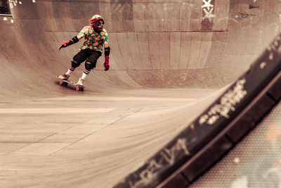 High angle view of boy skateboarding on road