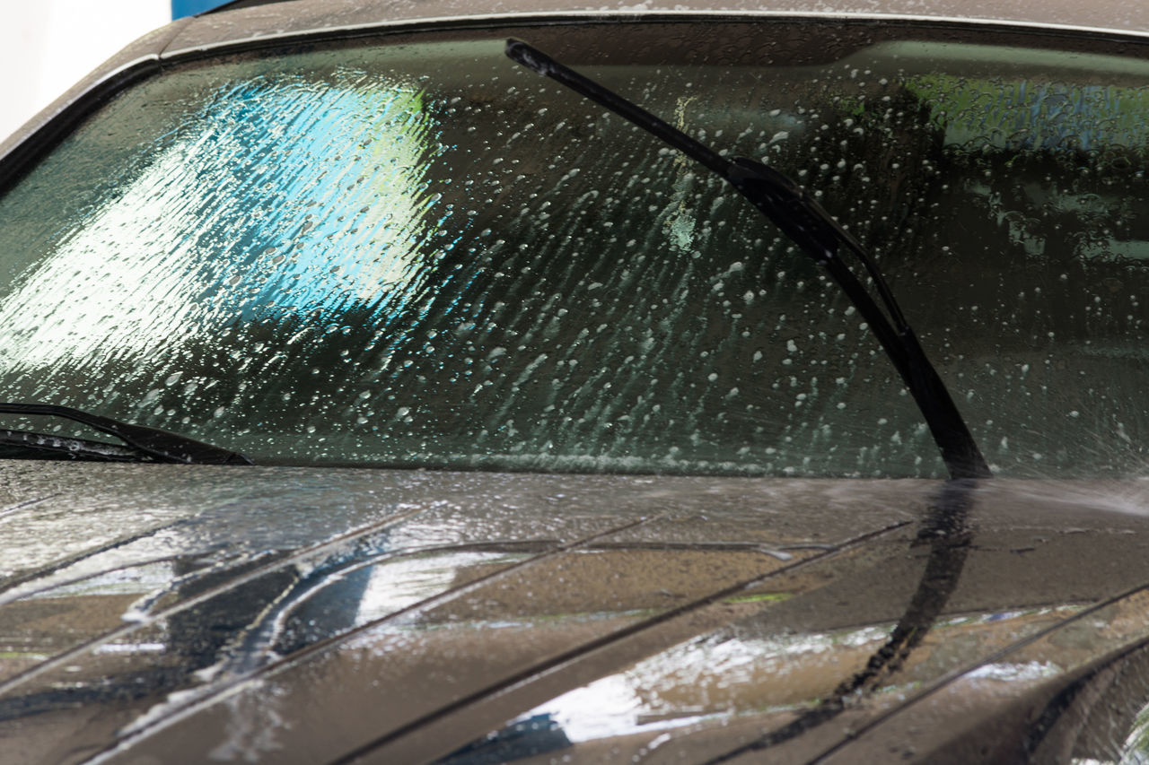 WATER DROPS ON CAR WINDSHIELD