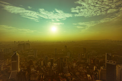 Scenic view of cityscape against sky during sunset