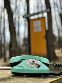 Close-up of telephone booth on tree