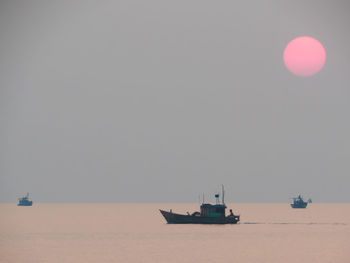 Boat in sea against clear sky