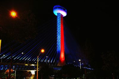 Low angle view of illuminated street light at night