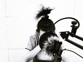High angle view of woman using sound recording equipment in studio
