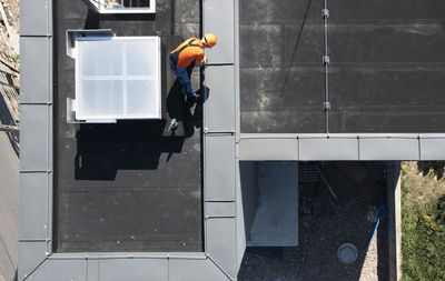 Rear view of man standing in building