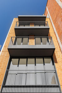 Bottom view of contemporary building facade. outdoor exterior of narrow modern house in barcelona