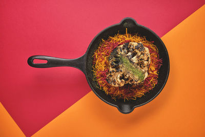 Directly above shot of fruits on yellow background