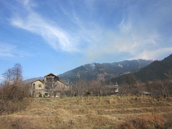 Built structure on landscape against sky