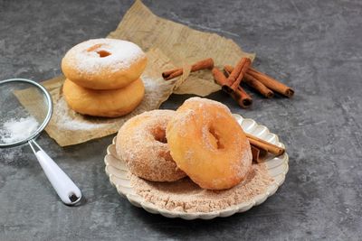 Homemade fresh fried donuts frosted with cinnamon and sugar. 