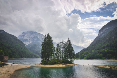 Scenic view of lake and mountains against sky