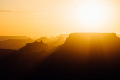 Scenic view of silhouette grand canyon against sky during sunset