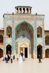 Group of people in front of historical building