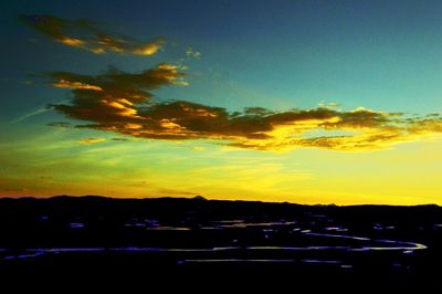 Silhouette landscape against sky during sunset