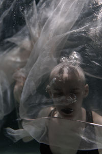 Portrait of woman swimming in sea