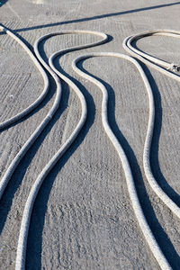 High angle shot of pipes on concrete