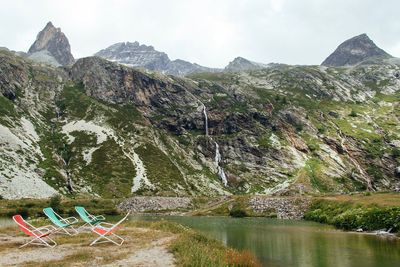 Scenic view of lake and mountains against sky