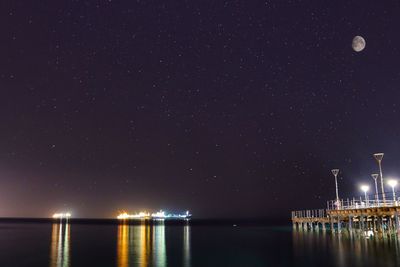 Scenic view of sea against sky at night