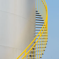 Yellow staircase against sky