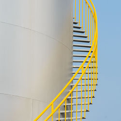 Low angle view of yellow staircase against sky