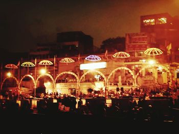 View of illuminated street lights at night
