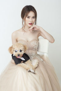 Portrait of a beautiful young woman over white background