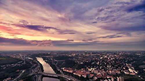 High angle shot of townscape against sky at sunset